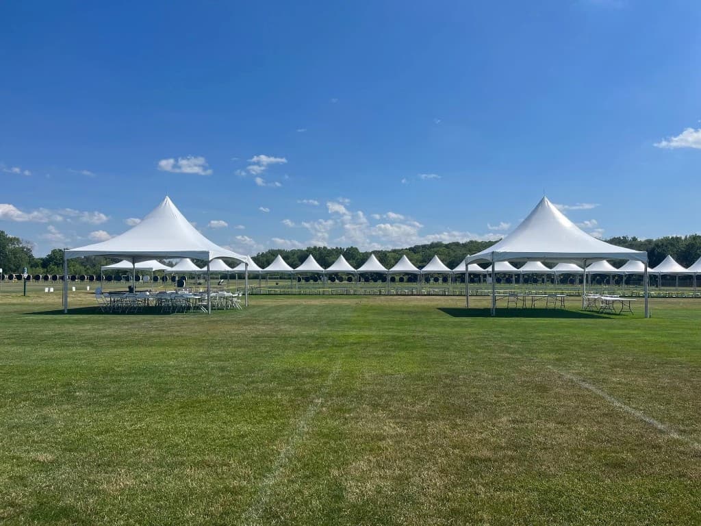 High-peak frame tent on pavement with ballast blocks for a Connecticut outdoor setup