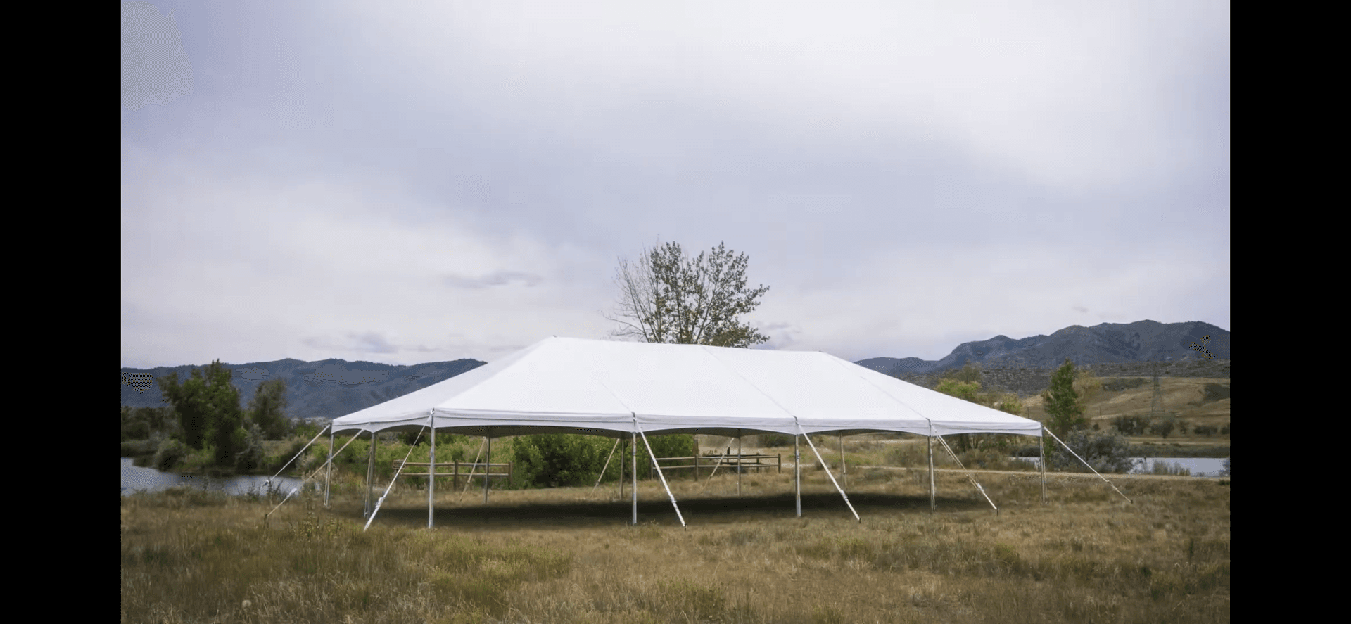White frame tent on a lawn for an outdoor event in the Middletown, Connecticut area