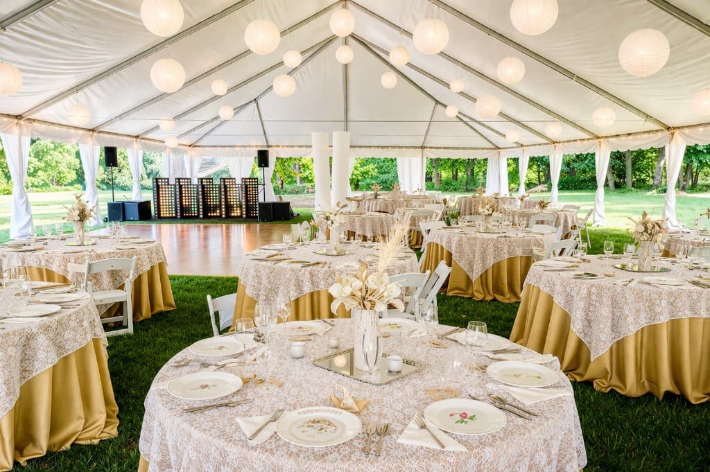 White event tent with tables and dance floor, Connecticut outdoor reception